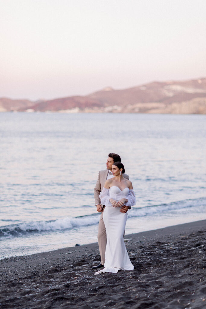 Santorini sunrise beach elopement bride and groom at the beach
Three Key Things To Consider When Planning a Coastal Wedding